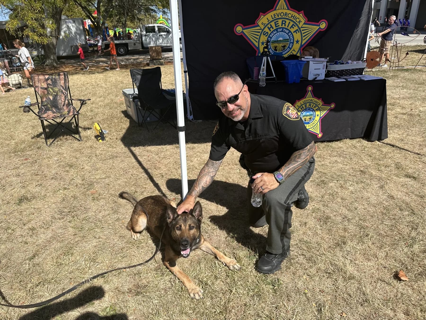 Sheriff Stephen Levorchick with a K-9 deputy at a community event